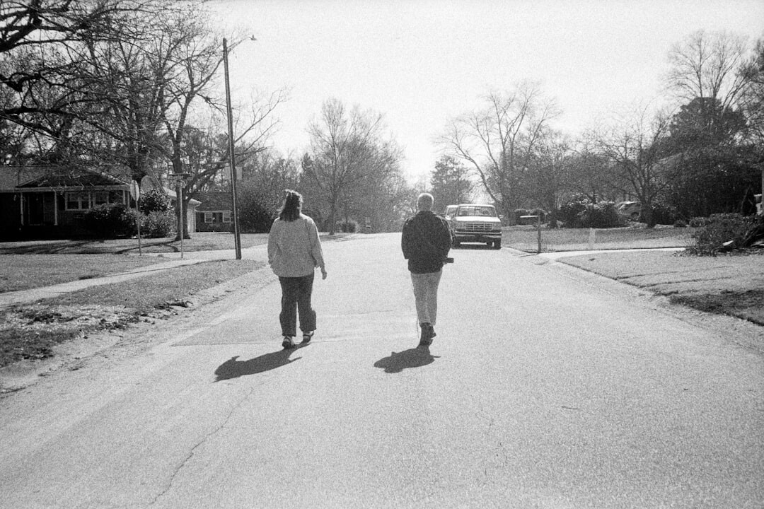 elderly people walking in neighborhood