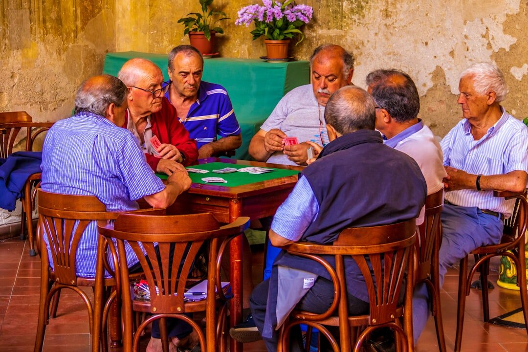 group of seniors playing cards
