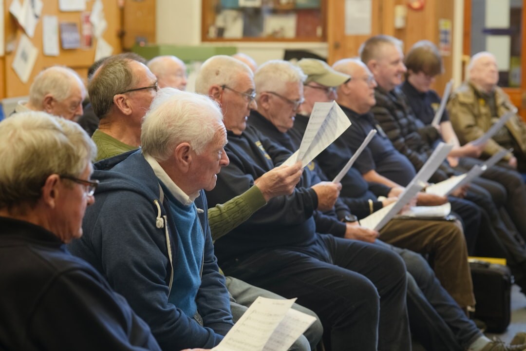 Group of seniors singing together during a choir rehearsal
