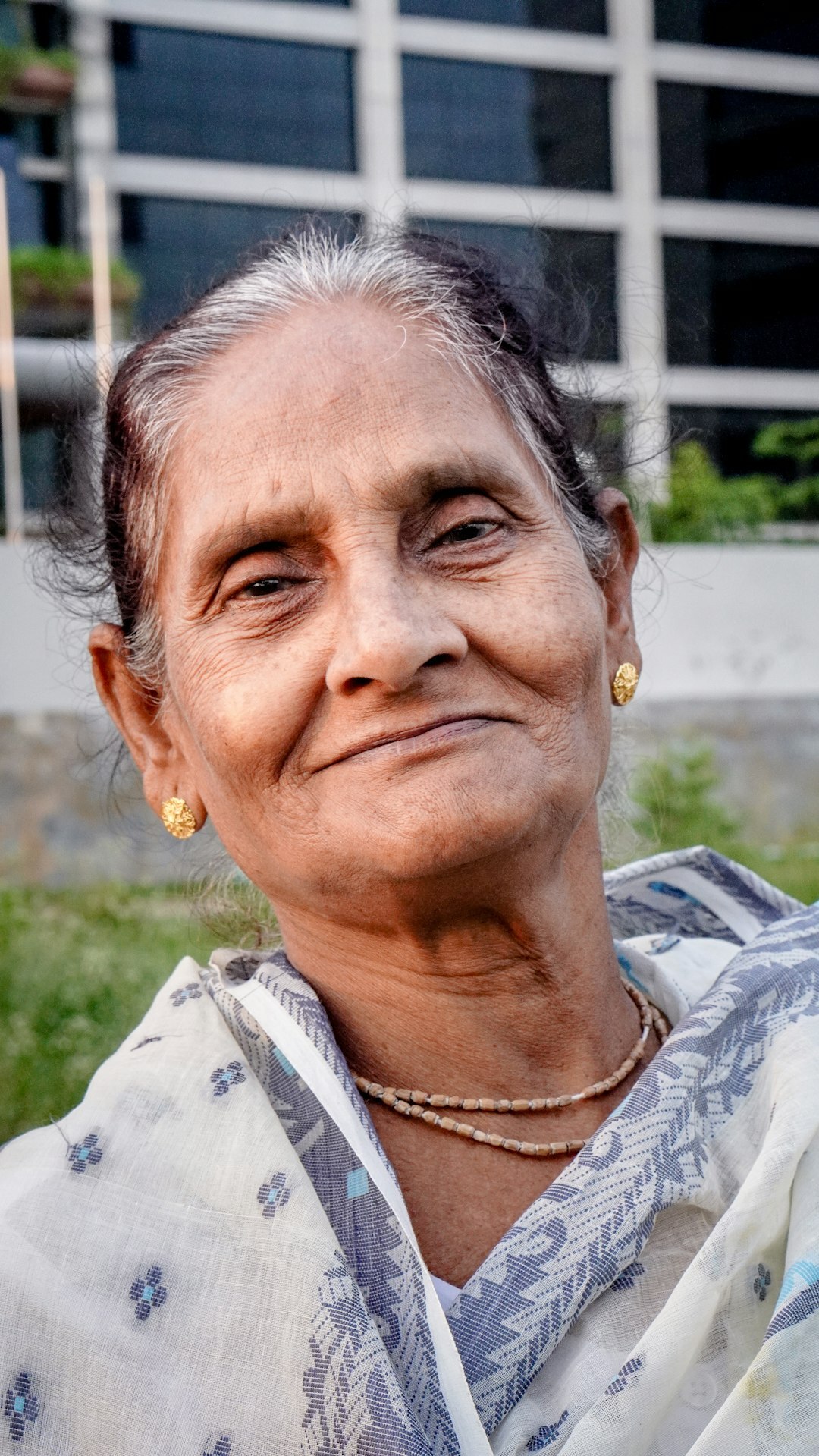 Portrait of a smiling elderly Swiss woman with gray hair