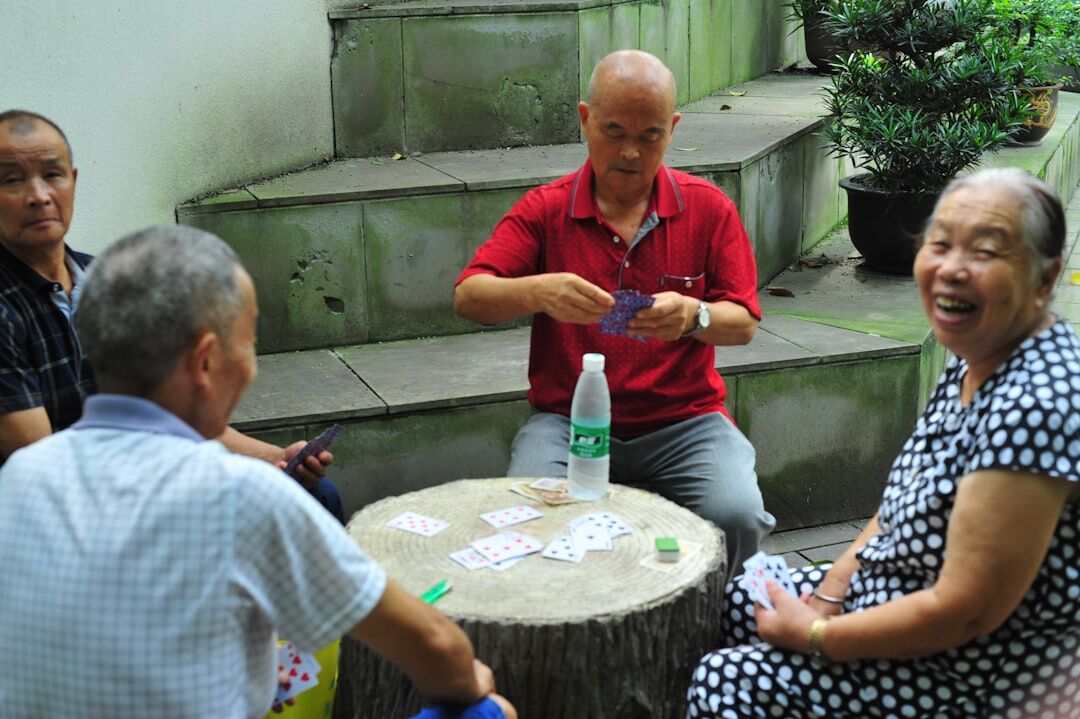 group of seniors playing cards